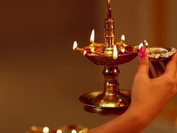 Close-up of a woman hand burning oil lamp Stock Footage