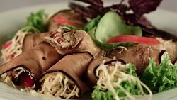 Cold starter. Eggplant rolls stuffed with grated cheese and tomatoes Stock Footage