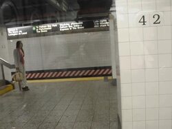 Transit worker directing customers on subway. Stock Footage