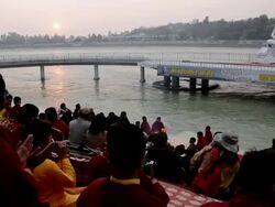 MS Pilgrims praying in front of statue of lord shiva at ganges river bank / Rishikesh, Uttarakhand, India Stock Footage