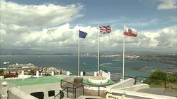 Flags flying over Gibraltar harbour News Clip
