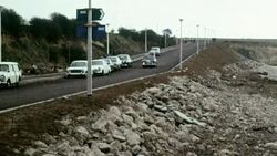 1969 MONTAGE Cars driving and arriving at the new Pegwell Bay hoverport for the SR.N4 hovercraft's cross-Channel trip / Kent, England Stock Footage