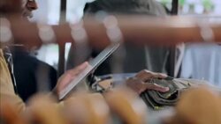 Clothing shop worker counts products and takes stock of store inventory with tablet Stock Footage