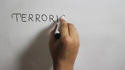 Hand writing a 'Terrorism has no religion' message on a white board using a black marker Stock Footage