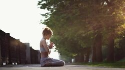 Young Woman Doing Yoga Meditation Exercises at Sunset Stock Footage