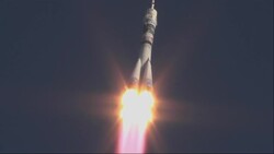 Russian Soyuz rocket carries crew with Olympic torch into space News Clip
