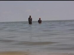 The beaches aren't crowded like typical this time of year along the Mississippi Gulf Coast, but there's still a few tourists soaking up the sun. While just down the road at the docks in Pass Christian, Miss., fishermen are struggling to get by and fear their entire way of life could vanish. News Clip