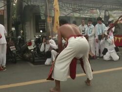 Axe swinging at Phuket Vegetarian Festival Stock Footage