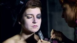 Artist hand painting woman's face for Halloween Stock Footage