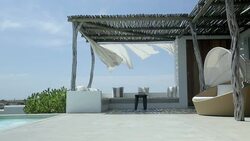 Wind blowing sheets on luxury patio Stock Footage