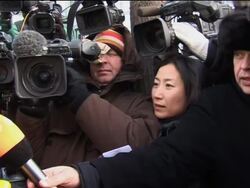 China sentences dissident to 11yrs; reax, def lawyer, wife News Clip