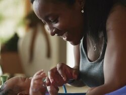 CU Woman washing baby boy (2-5 months) in bathtub / Cedar Hills, Utah, USA Stock Footage