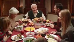 Grandpa telling a story at Thanksgiving dinner Stock Footage