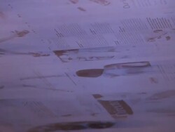 Close Up static - Printed magazine pages speed through a roller in a factory /  Wisconsin, United States Stock Footage