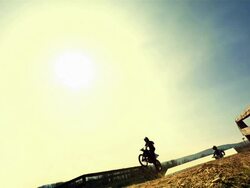 HD Super Slow-Mo: Dirt Bikers Jumping High Stock Footage