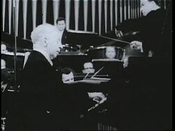 Pianist Arthur Rubinstein performs with the Polish National Philharmonic on Frederick Chopin's 150th anniversary. News Clip
