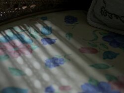 ECU timelapse light in a decorated armchair Stock Footage