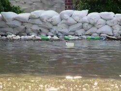 May 9, 2011 Mississippi River Flooding Sandbags stacked up to protect Condos at Mud Island, Memphis, Tennessee, USA Stock Footage