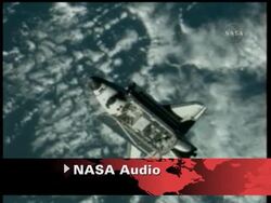 The gouge goes all the way through tiles.  Repairs might be needed before re-entry. News Clip