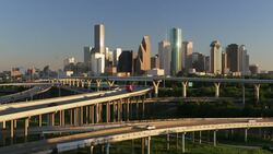 High angle view of a multiple lane highways with skyscrapers in the background, Houston, Texas, USA Stock Footage