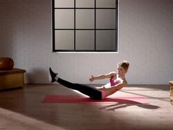 Woman doing her workout in gym (stomach exercise) Stock Footage