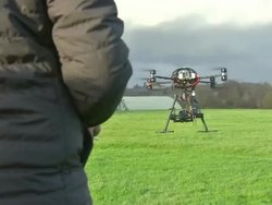 Remote-controlled camera drone being operated News Clip