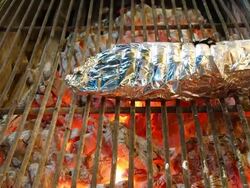 grilled fish in aluminum foil Stock Footage