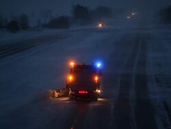 Winter Evening Interstate Highway with Blowing Snow and Plow Stock Footage