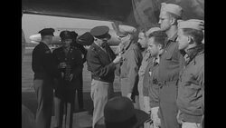 US Gen. Hap Arnold presents Col. Clarence Irvine with Distinguished Flying Cross in 1945 News Clip