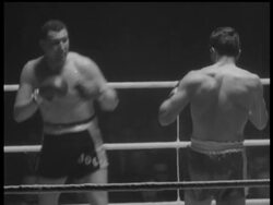 COOPER RETAINS TITLES News Clip