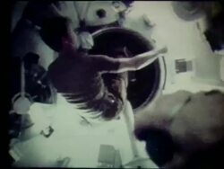 Astronaut throwing ball + entering tube in zero gravity Stock Footage