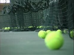 Tennis balls on court Stock Footage