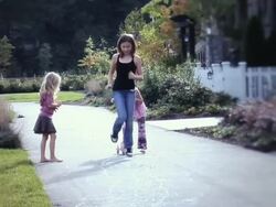 WS Girls playing hopscotch on sidewalk / Langley, British Columbia, Canada.  Stock Footage