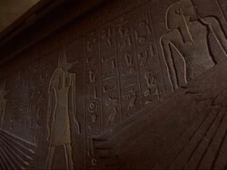 Close Up, static - The walls of a tomb feature Egyptian figures and hieroglyphics Stock Footage