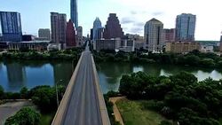 Over Congress Avenue Crossing Congress Bridge flying right up to Austin Texas Downtown Congress View Stock Footage