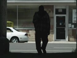 WS TD Homeless man walking on street toward camera, Salt Lake City, Utah, USA Stock Footage