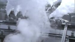 Steam billows from a paper mill. Stock Footage