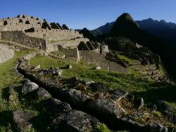 T/L, WS, sunrise Machu Pichu with water canal foreground / Peru Stock Footage