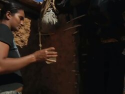 MS TS Shot of Woman cooking in city with water from shaft / Pilao Arcado, Bahia, Brazil Stock Footage