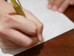 Writing on a paper Stock Footage