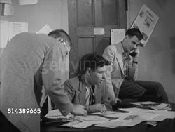 1953: YALE DAILY NEWS: YALE UNIVERSITY: VS Assignment Editor Lawrence Newman working at desk, talking w/ 'Healer' Warren Zimmerman about writing an article, Newman talking to another male about a date. Instructional Video