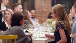 MS Two smiling women in discussion during dinner party Stock Footage