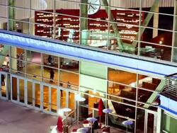 CU T/L ZI Main lobby of ArcLight movie theater multiplex as theater patrons enter and exit lobby / Hollywood, California, USA  Stock Footage