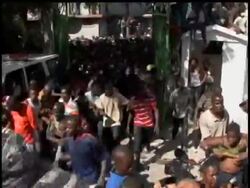 Hundreds of people jostled and fought with each other in Haiti''s capital on Thursday as an attempt to distribute food packages went out of control. News Clip