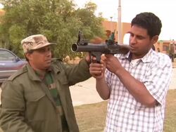 Civilian Being Trained With Weaponry News Clip