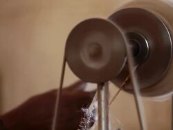 CU Shot of bobbin in local factory transforming wool to make carpet / Gochas, Hardap, Namibia Stock Footage