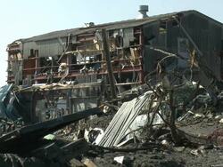 Damage in port area of Kesennuma City, Japan filmed on 1 April 2011, 3 weeks after a tsunami which was caused by magnitude 9 Tohoku earthquake off north east Japan / AUDIO Stock Footage