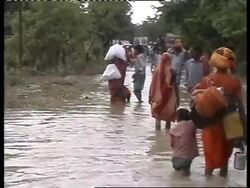 Troops and aid workers try to reach people stranded in floods News Clip