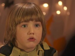 HD DOLLY: Frightened Little Boy Listening Halloween Stories Stock Footage