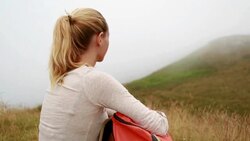 Hiker having a break in nature Stock Footage